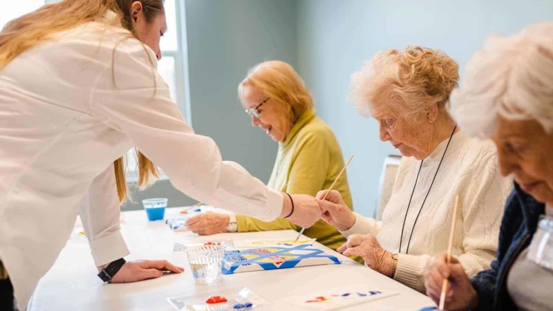 Senior women painting